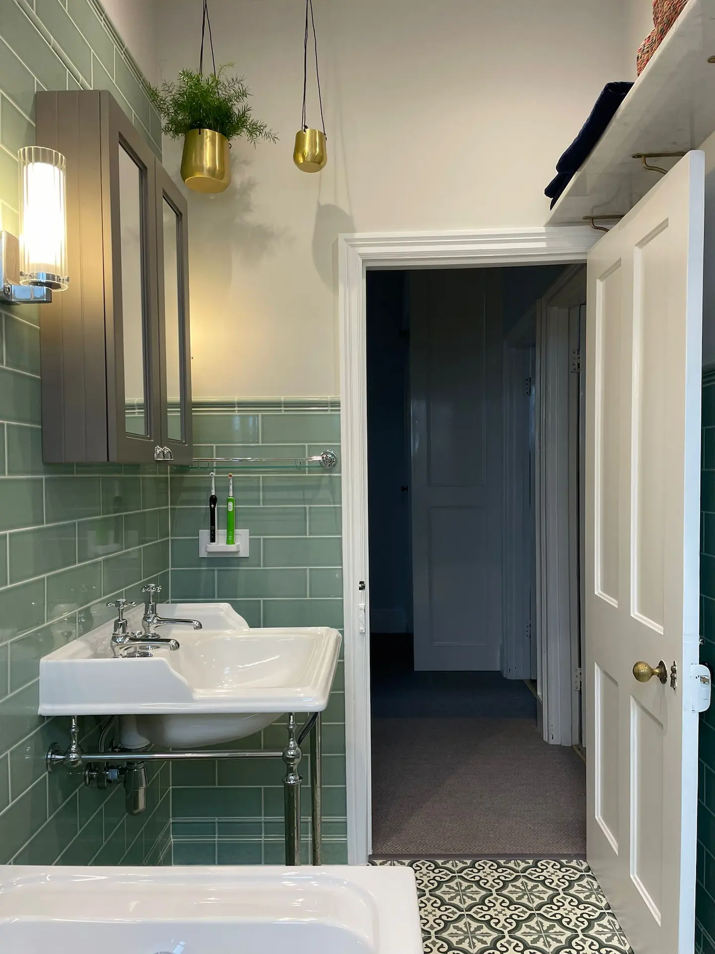 bespoke london bathroom renovation featuring mint green metro tiles and a classic double basin washstand by kbb master